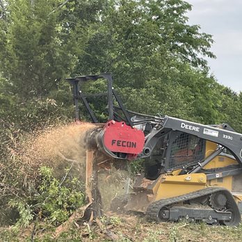Spartan Forestry & Mulching - a bulldozer clearing a tree - Landscaping Near Me - Hawk Point, Missouri