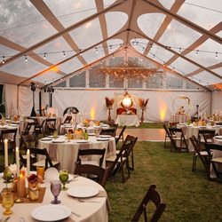 Thistledome House - Outdoor wedding reception under a tent at Thistledome House.