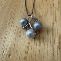 Three pearl necklace
