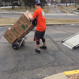 Sam helps move heavy boxes filled with books. Thanks, Sam!