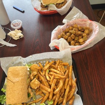 Northlake Seafood - a sandwich and fries on a table - Seafood Markets Near Me - Mandeville, Louisiana