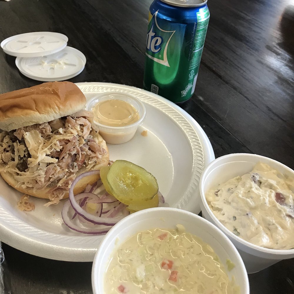 Pulled chicken with white bbq sauce, potato salad, and coleslaw Pulled chicken with white bbq sauce, potato salad, and coleslaw