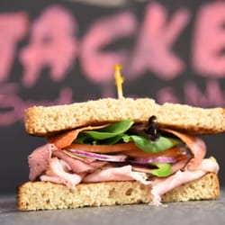 1/2 Italian. Ham, pastrami and pepperoni topped with peppers, onions, tomatoes and spring mix.