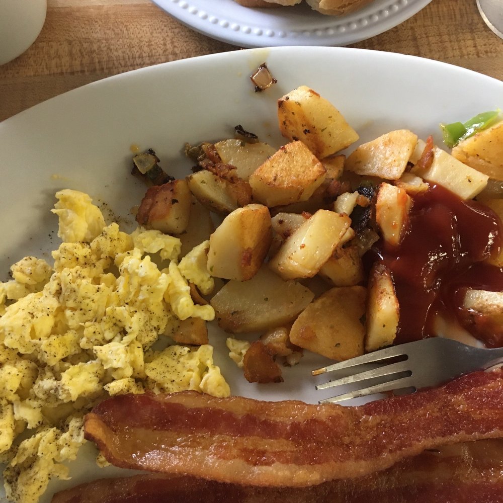 Regular big breakfast with three pieces of bacon home fries and scrambled eggs $6.99. They charge extra for coffee.