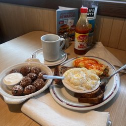 Huddle House - Blueberry Bites, Grits w/cheddar cheese, Raisin toast,  Veggie omelet w/cheddar cheese & hot sauce on it.