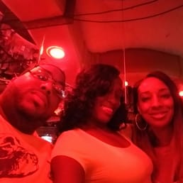 three people posing for a picture three people posing for a picture