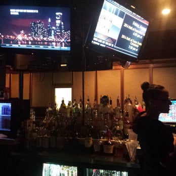 Eddy's Tavern & Social San Antonio - Perrin Beitel - a bar with a large screen tv - Sports Bars Near Me - San Antonio, Texas