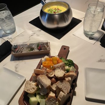 The Melting Pot - Loaded Baked Potato Cheese and dippers - Fondue Near Me - Huntersville, North Carolina The Melting Pot - Loaded Baked Potato Cheese and dippers - Fondue Near Me - Huntersville, North Carolina