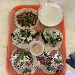 Clucker taco, carne asada tacos, and the staple tacos. Side of queso.