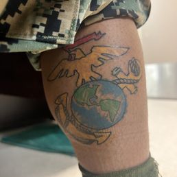 An eagle globe and anchor tattoo as if it were colored in crayon An eagle globe and anchor tattoo as if it were colored in crayon