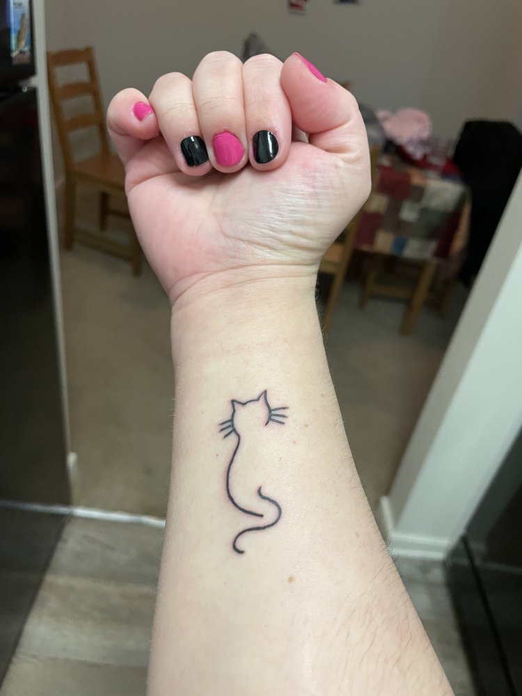 Absolute Art Tattoos Logo