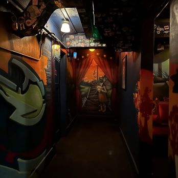 The Vault - a long hallway with graffiti on the walls - Speakeasies Near Me - Tacoma, Washington The Vault - a long hallway with graffiti on the walls - Speakeasies Near Me - Tacoma, Washington