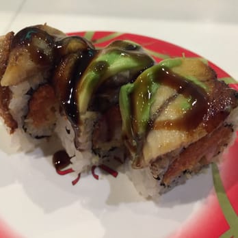 Sushi Train - Dragon roll (crab stick, avocado, cucumber topped with eel & eel sauce) - Sushi Bars Near Me - Nashville, Tennessee Sushi Train - Dragon roll (crab stick, avocado, cucumber topped with eel & eel sauce) - Sushi Bars Near Me - Nashville, Tennessee