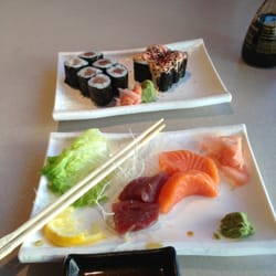 Kujira Sushi Bar & Grill - Tuna and salmon sashimi with tuna maki and a spicy scallop roll.