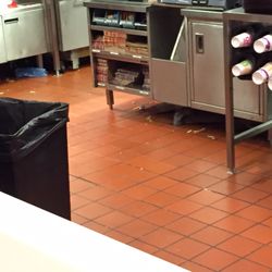 McDonald's - Food all over the floor while 3 people stood around chatting, 2 were managers.