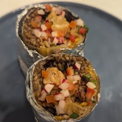Playa Taqueria - SHORT-RIB SUADERO BURRITO Tello Mexican rice, choice of black or refried beans, cheddar jack cheese, salsa verde, crema and pico de gallo