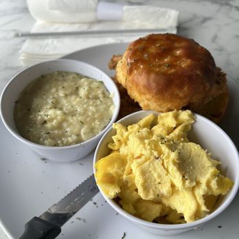 Nouveau - Honey Butter Chicken biscuit with grits and eggs. - Bars Near Me - Jonesboro, Georgia Nouveau - Honey Butter Chicken biscuit with grits and eggs. - Bars Near Me - Jonesboro, Georgia