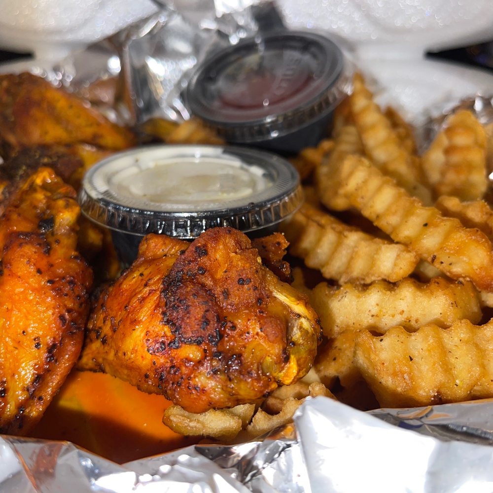 Habibi cafe - Lemon pepper wings and Cajun fries - Hookah Bars Near Me - Davie, Florida
