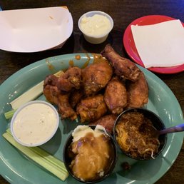 a plate of chicken wings and dips a plate of chicken wings and dips