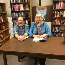 Mechanicsburg Mystery Book Shop - Vicki Delany signs a copy of her latest book for a fan.