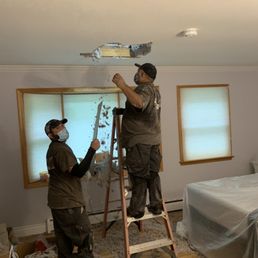 The big dude in the ladder is the one who went through my ceiling because they didn't put plywood down as agreed to.