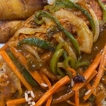 Spices Caribbean Restaurant - Red snapper over beans and rice with plantains - Caribbean Near Me - Jacksonville, Florida Spices Caribbean Restaurant - Red snapper over beans and rice with plantains - Caribbean Near Me - Jacksonville, Florida