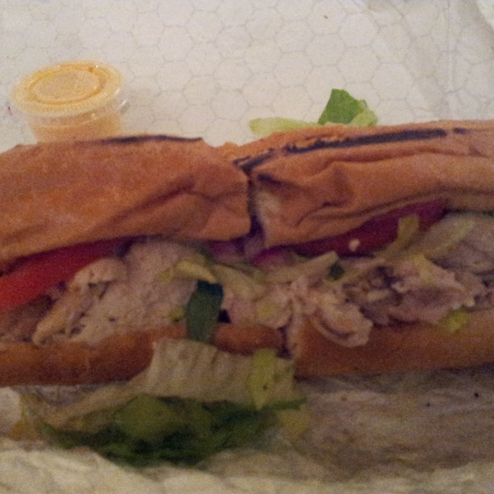 Crisp & Juicy - latino chicken sandwich...chicken breast, marinated onion, lettuce, tomato. pretty good but you def need the yellow sauce - Chicken Shop Near Me - Silver Spring, Maryland