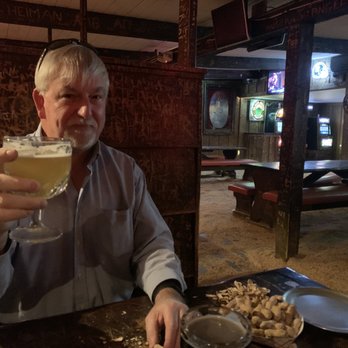 Moose's Saloon - Kyle enjoying Peanuts and beer at the Moose Salon. - Pizza Near Me - Kalispell, Montana