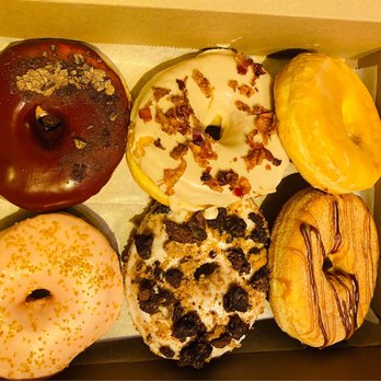 Grounds Donut House - From top left moving clockwise: Chocolate + Cherry, Maple Bacon, Glazed, Churro, Brookie, and Peach Bellini - Donuts Near Me - Danbury, Connecticut