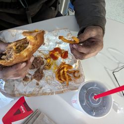 Arby's - Arby's roast beef and cheese, curly fries and a medium coke