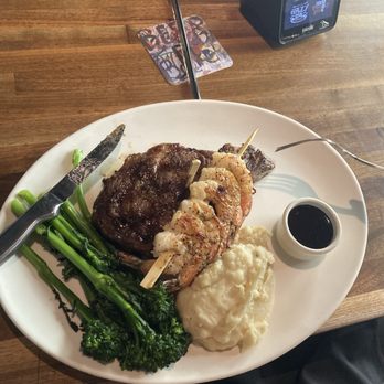 Yard House - Sirloin and shrimp with baby broccoli and mashed potatoes. - Bars Near Me - Glendale, Arizona Yard House - Sirloin and shrimp with baby broccoli and mashed potatoes. - Bars Near Me - Glendale, Arizona