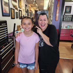 Koolsville Body Piercing - Our daughter is so proud of her earrings!!! And well-educated about their maintenance, thanks to Carrie!!!