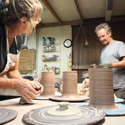 Foelber Pottery Gallery & Studios - Owners and potters, John Foelber and Judy Adams, working in the studio