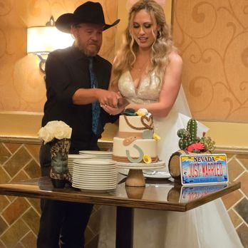 Las Vegas Custom Cakes - Bride and Groom cutting the cake at reception - Custom Cakes Near Me - Las Vegas, Nevada Las Vegas Custom Cakes - Bride and Groom cutting the cake at reception - Custom Cakes Near Me - Las Vegas, Nevada