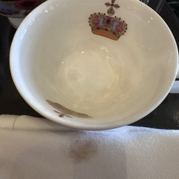 Filthy tea cup that left a noticeable stain when wiped.
