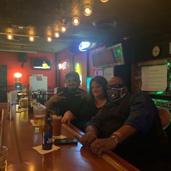Skippers Lounge - a group of people sitting at a bar - Lounges Near Me - Glendale, Arizona