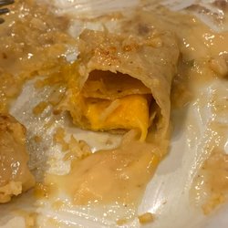 Pulido's Mexican Restaurants - Cold cheese enchilada with water flavored queso and a cold hard cheese log inside a cold tortilla