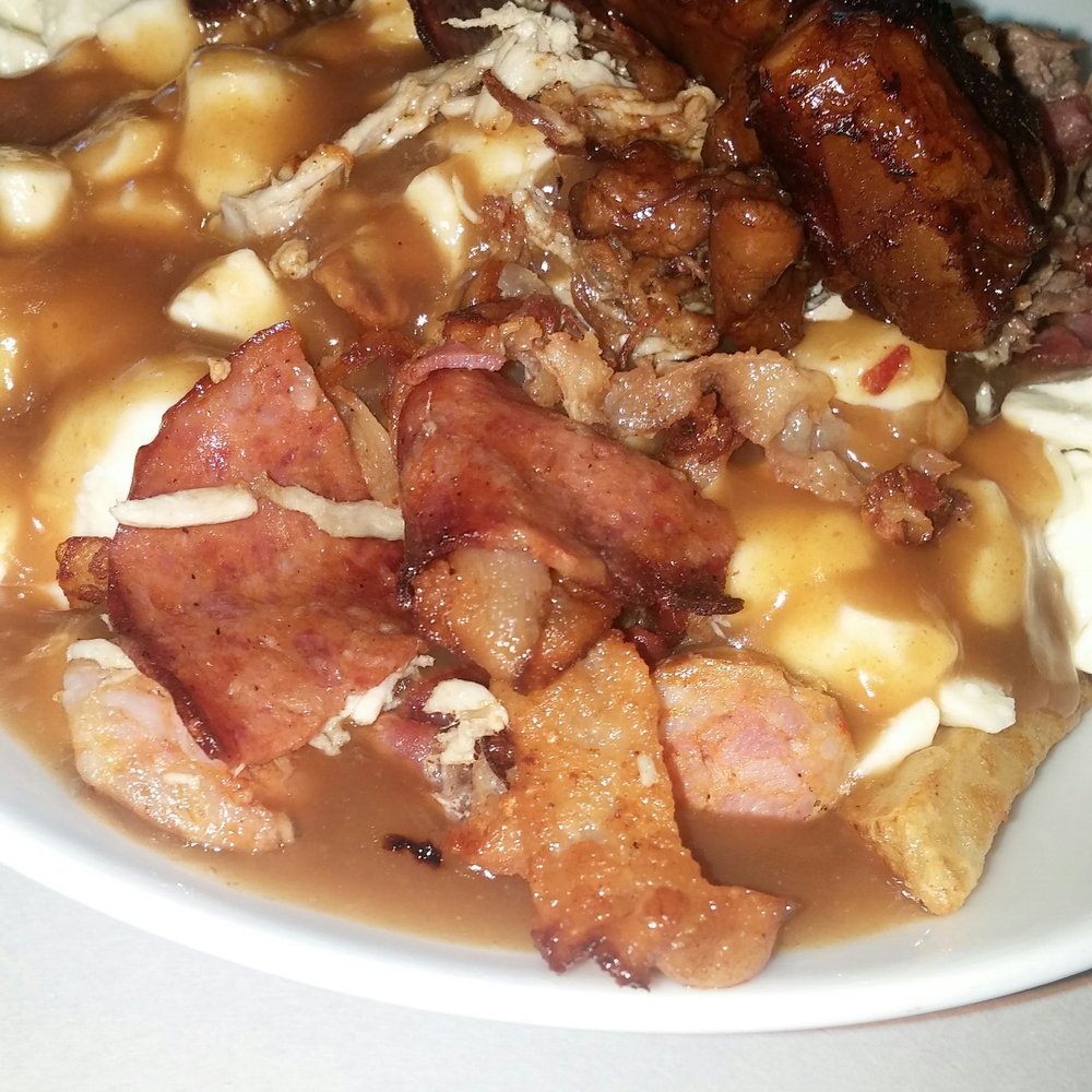 Le Poutine Bar - So this what they call the explosion poutine @ poutine bar And i must say it was delicious. And yes that is a rib. - Poutineries Near Me - Laval, Quebec Le Poutine Bar - So this what they call the explosion poutine @ poutine bar And i must say it was delicious. And yes that is a rib. - Poutineries Near Me - Laval, Quebec