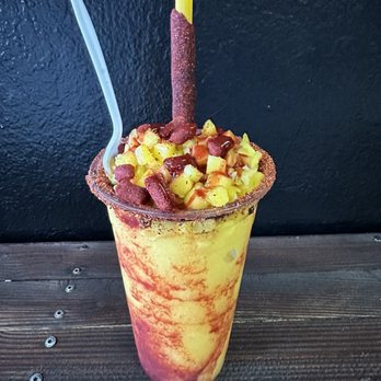 Botanas La Cruda - Called fruit drink with spicy Mexico seasoning around the rim and straw. Freaking delicious. - Seafood Near Me - Vallejo, California