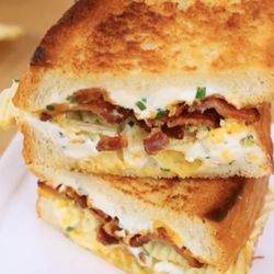 The mother load: Bacon sour cream ruffles potato chips green onion sour cream served on sourdough
