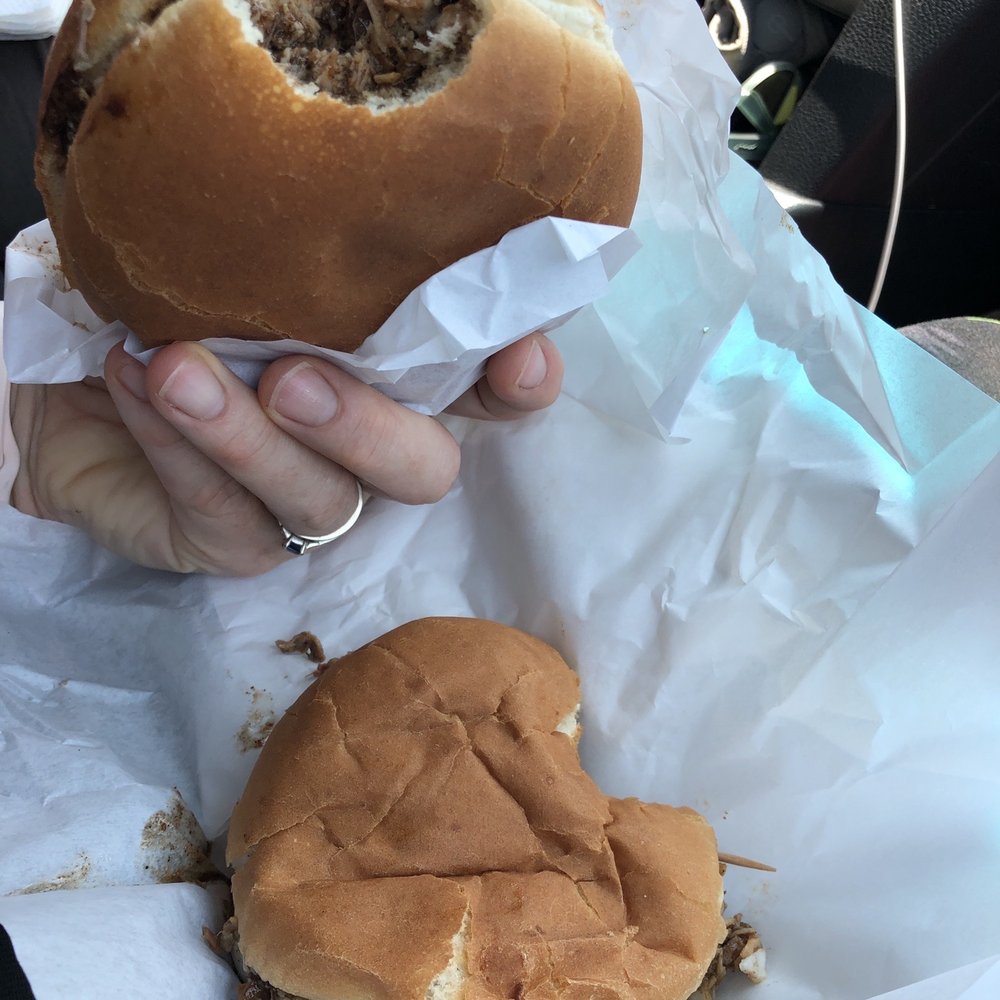 Cypress Corner Bar-B-Q - Holding my husbands jumbo for comparison, about twice the sandwich as the regular for only $0.75 more! - Barbeque Near Me - Lexa, Arkansas