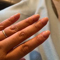 A Q Nails & Spa - Dip manicure in a nude color three weeks later.