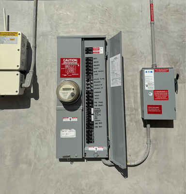 Electrical panel upgrade on the side of a house