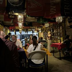 Maro's Shrimp House - Lots of tables inside and many university flags with autographs on them. Live music!