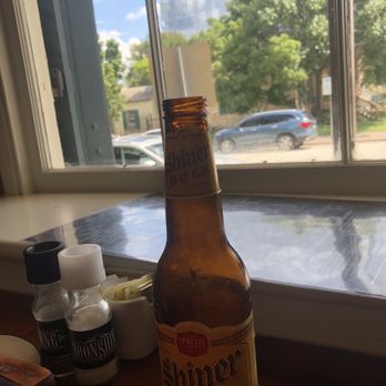Moonshine Grill - Roses, beer. A fly on in the window. This is America. - Southern Near Me - Austin, Texas