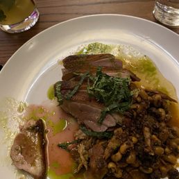 The duck confeit, black eyed pears, mint, lemon marmalade The duck confeit, black eyed pears, mint, lemon marmalade