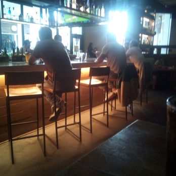 California Pizza Kitchen - The bar area had hangers you could place your pieces the look of metal of the bar brings out the color. - Pizza Near Me - San Diego, California