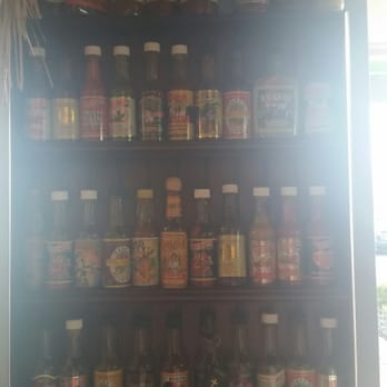 Pelon's Baja Grill - The wall of hot, mild and in between sauces. - Mexican Near Me - Norfolk, Virginia Pelon's Baja Grill - The wall of hot, mild and in between sauces. - Mexican Near Me - Norfolk, Virginia