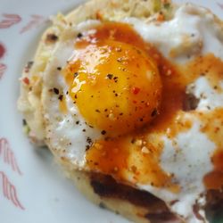 Ricas Pupusas Salvadoreñas - The Revuelta pupusa for breakfast.    I added a fried egg, the curtido & picante salsa.  Delicioso!  Muy Rico pupusa!