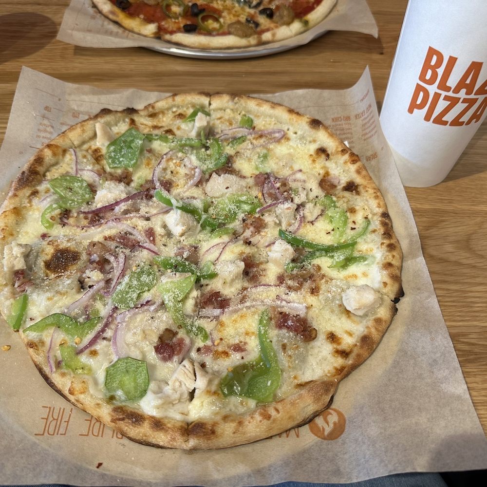 two pizzas on a table